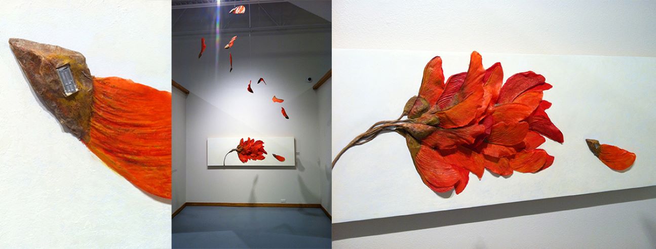 Gallery Display of a 3-D sculpture of a red flower.  