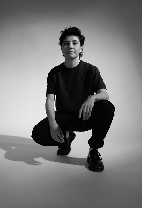 black and white photo of a person crouching down