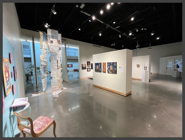 Art gallery with portraits and 3-D sculptures