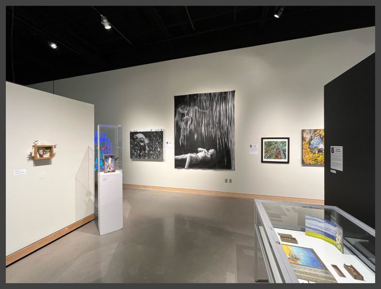 Art gallery with portraits and 3-D sculptures