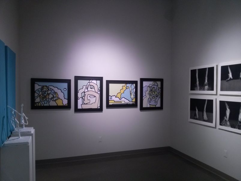 Art gallery with portraits and 3-D sculptures