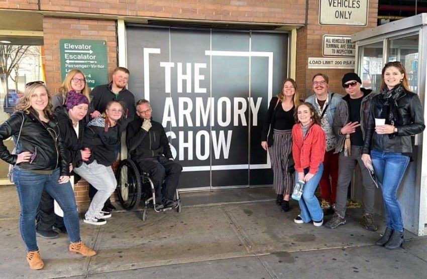 A group of Art Students in the street outside an Art Gallery