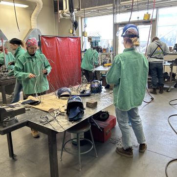 Students working in steel shop