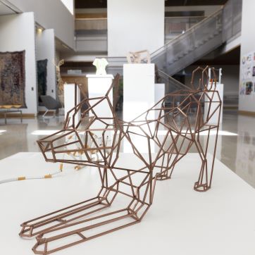 3-D wire sculpture of excited puppy