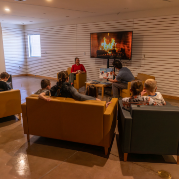 Families in the museum's resource room for 'Tis the Season events