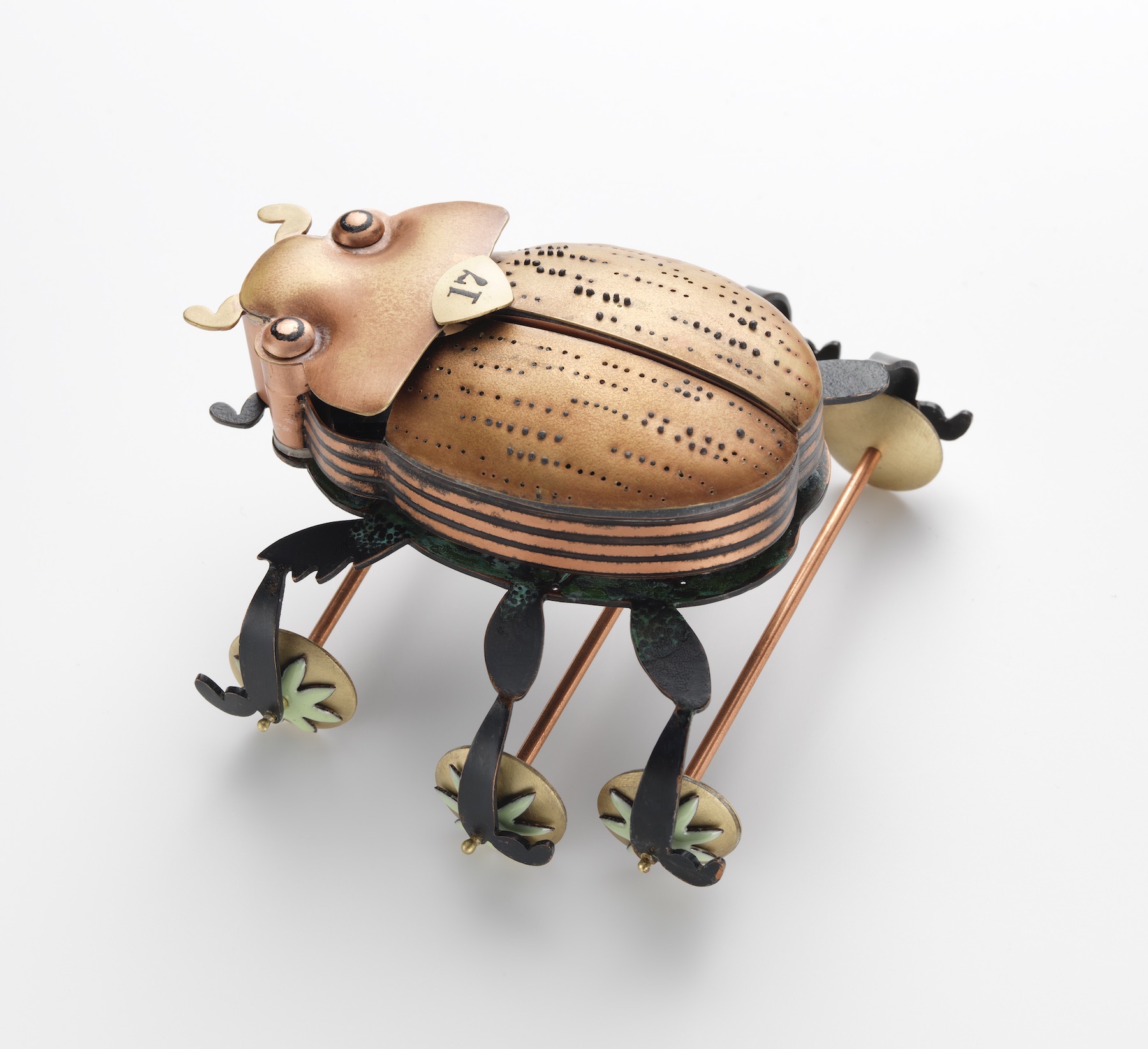 Leah Hardy, Scarabaeidae and the Celestial Circus, 2018, hydraulic pressed and fabricated copper and brass, enamel, patina, 2.25 x 4” x 3.75 inches, courtesy of the artist