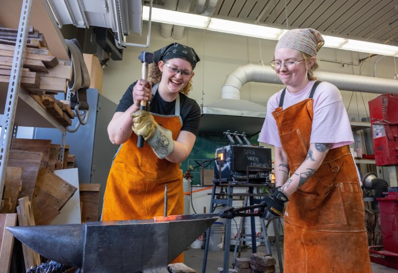 Two female students metalsmith