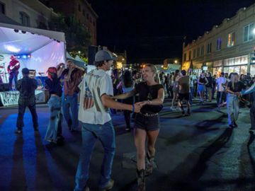 Students swing dancing downtown