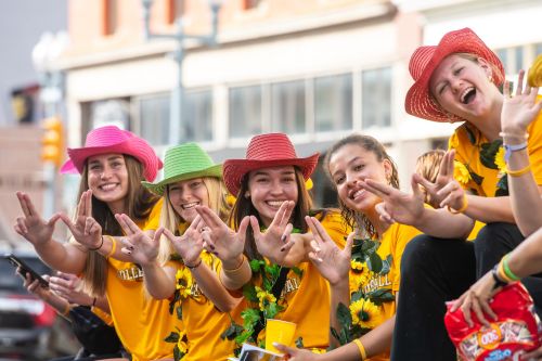 Several students smile during homecoming 2023