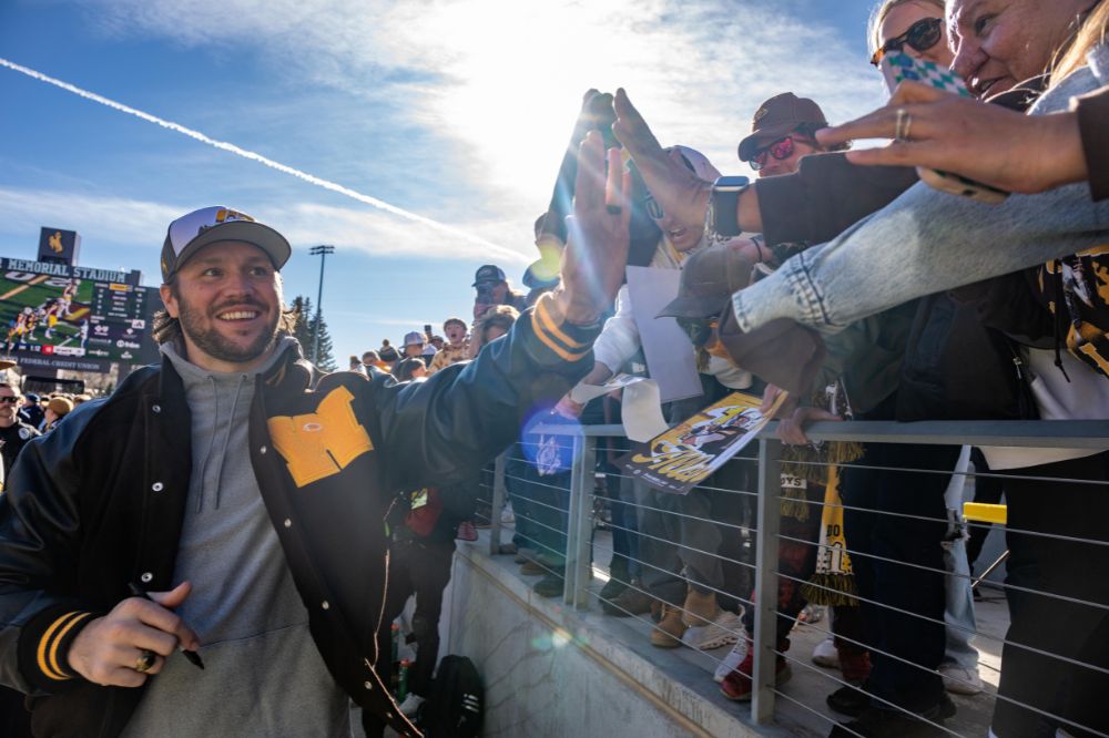 Josh Allen gives a fan a high five