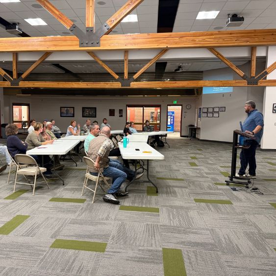 UW professor brad rettler speaks to a group in Pinedale