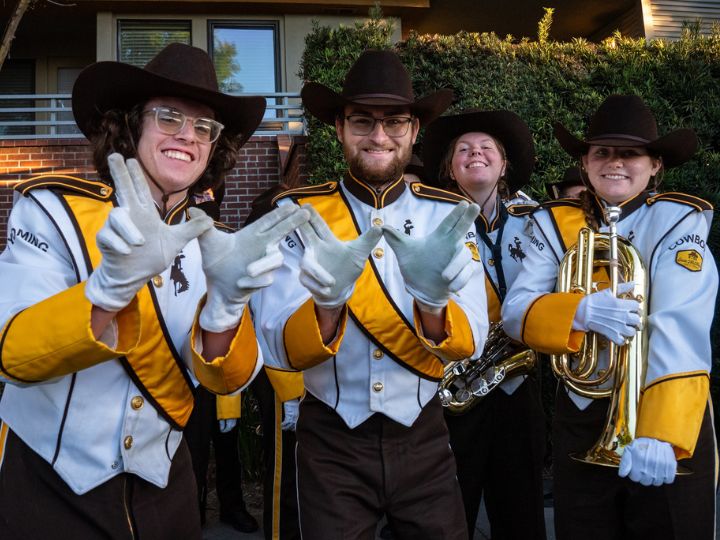 Band students smile and pose for a photo