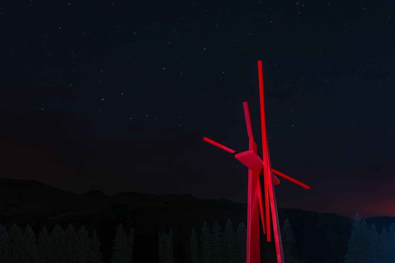 John Henry sculpture at night