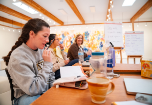 People gathered at a table for a meeting