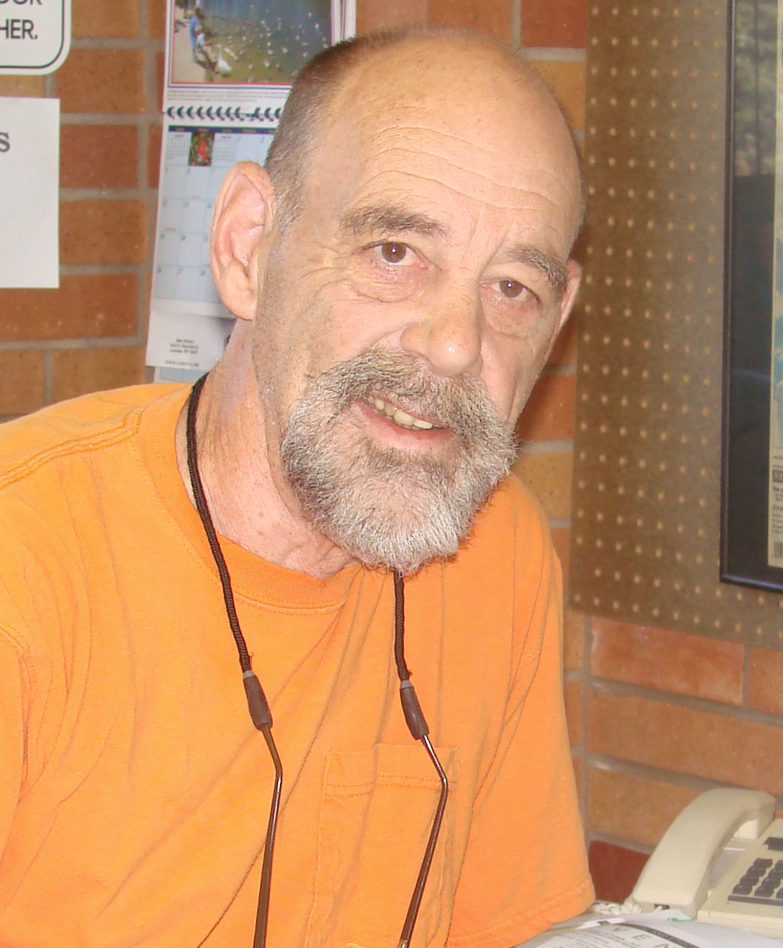 George Gladney pictured in orange shirt
