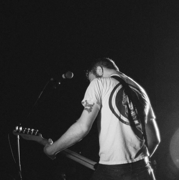 musician playing a guitar