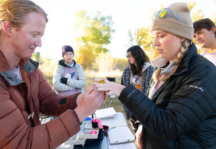 A UW student organization participates in some field work with wildlife