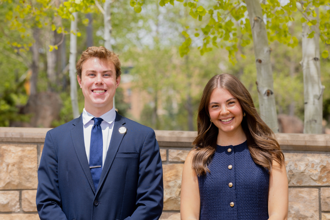 Two ASUW student government officials stand together and smile