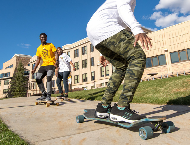 Two students skateboarding