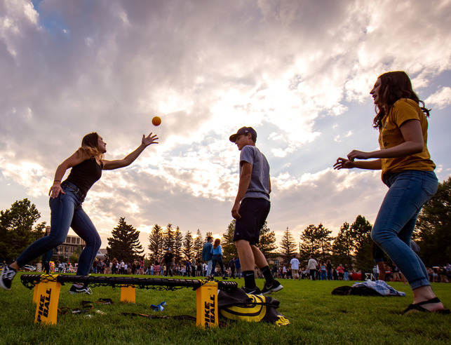 Students playing game on grass
