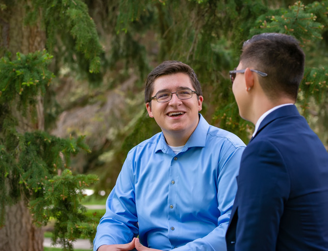 Two students talking and laughing