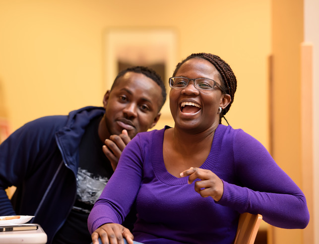 Two students laughing