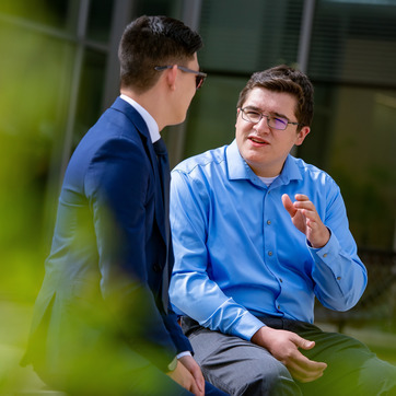 Two students talking outside