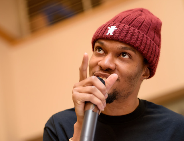 Student presenting with mic