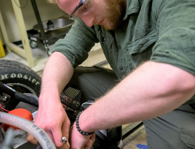 Student working on bike