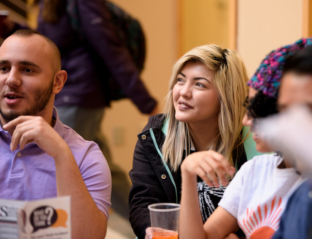 Three students talking