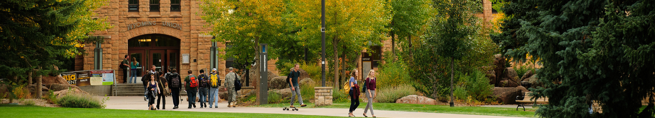 Students walking to and from the Union building in the fall 