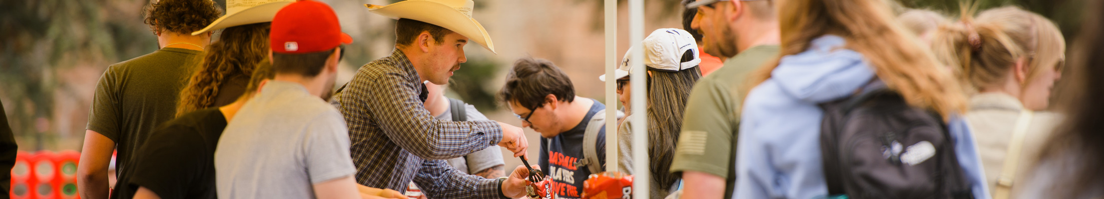 ASUW Senators hand out food to students as they celebrate the end of the academic year