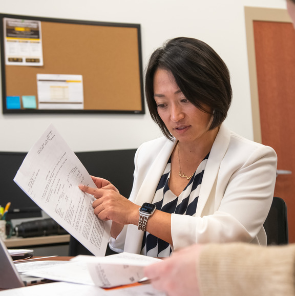 Women holding document