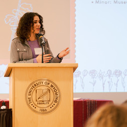 Women speaking at a microphone