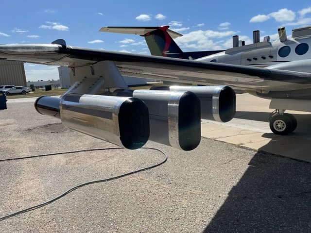 Closeup view right-hand wing's drag test flight installation on the King Air