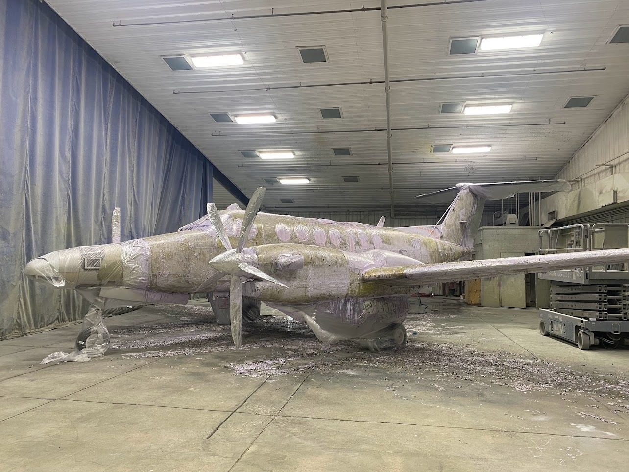 The aircraft in the process of paint removal