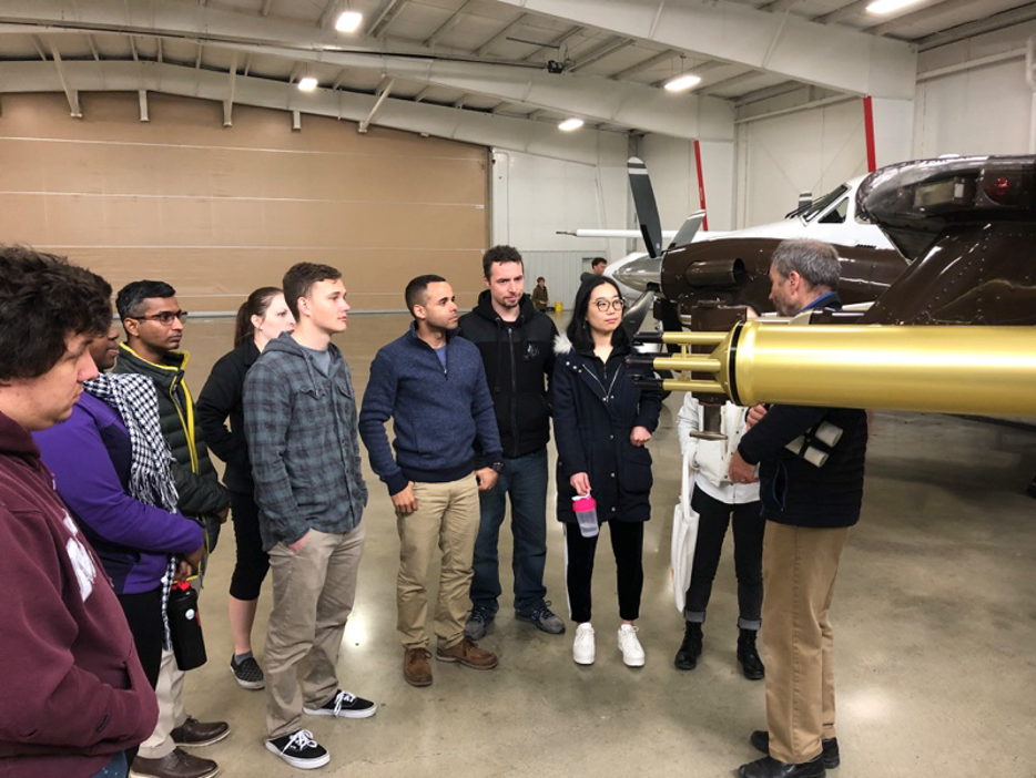 Students learning about the King Air during a facility open house for TECPEC