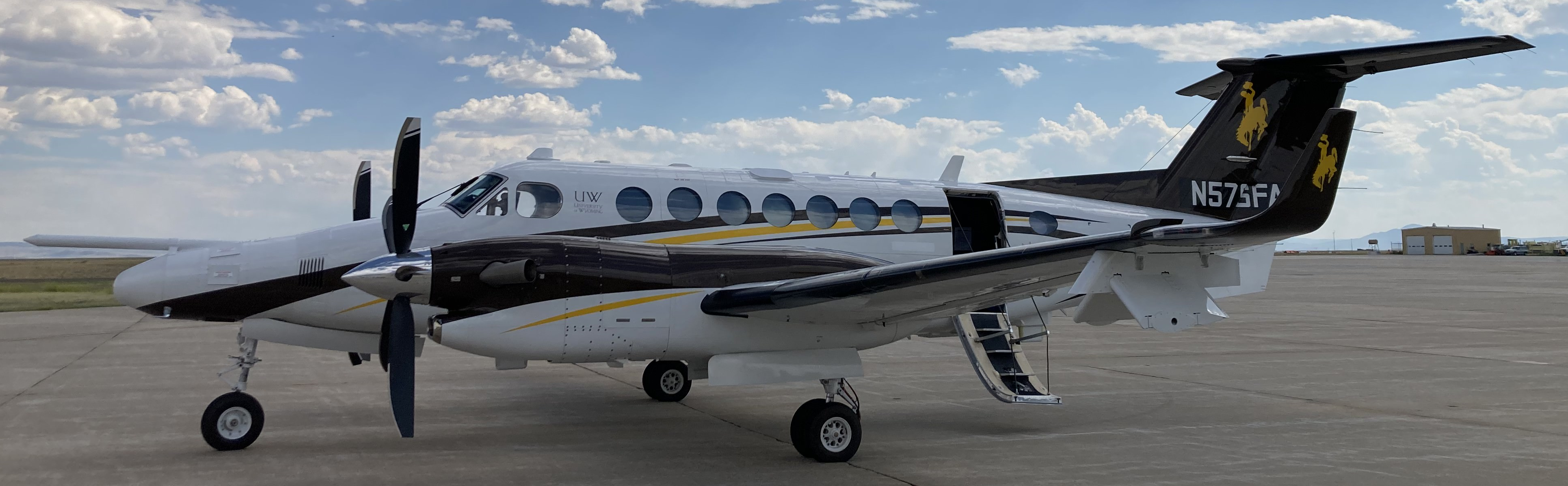 UWyo King Air with new paint job on wet tarmac on cloudy day