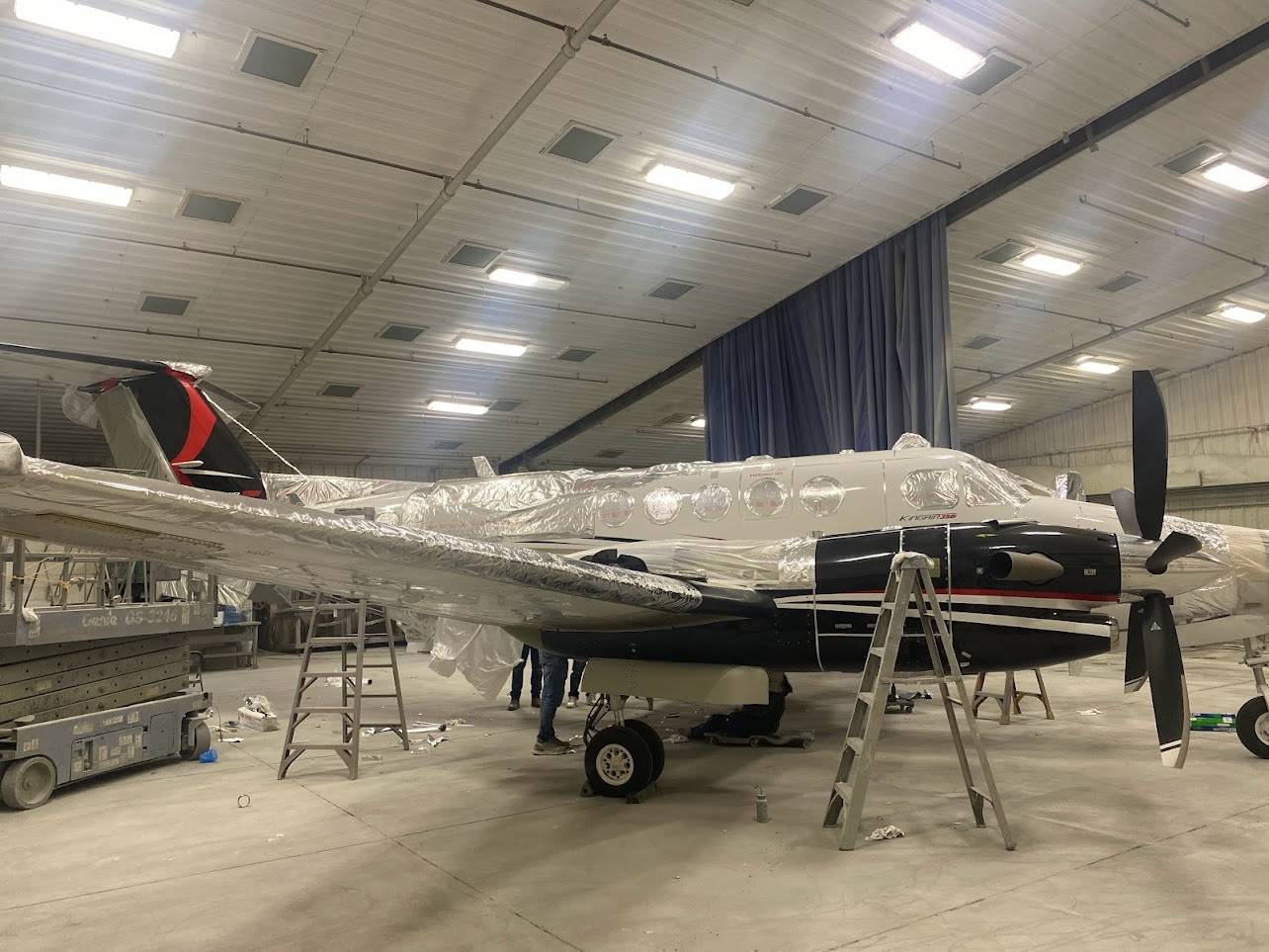 The aircraft being prepared for paint removal