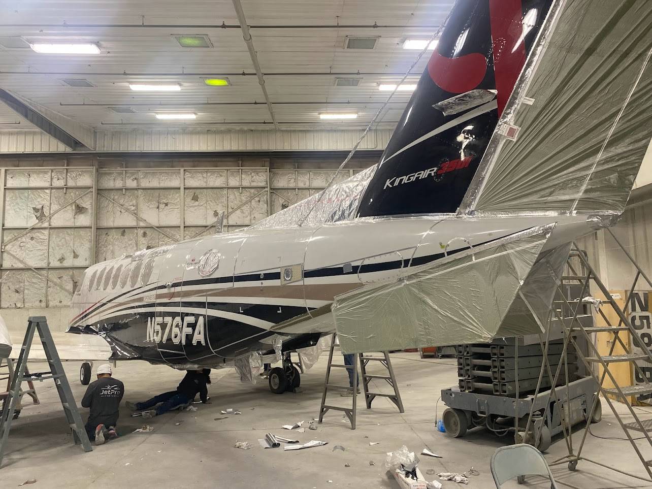 The aircraft being prepared for paint removal