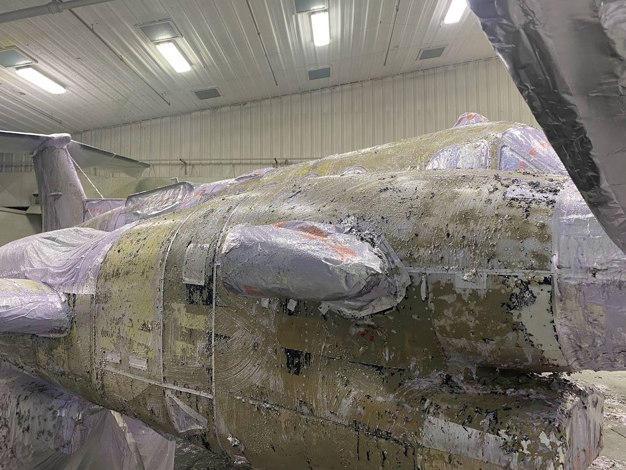 The aircraft in the process of paint removal