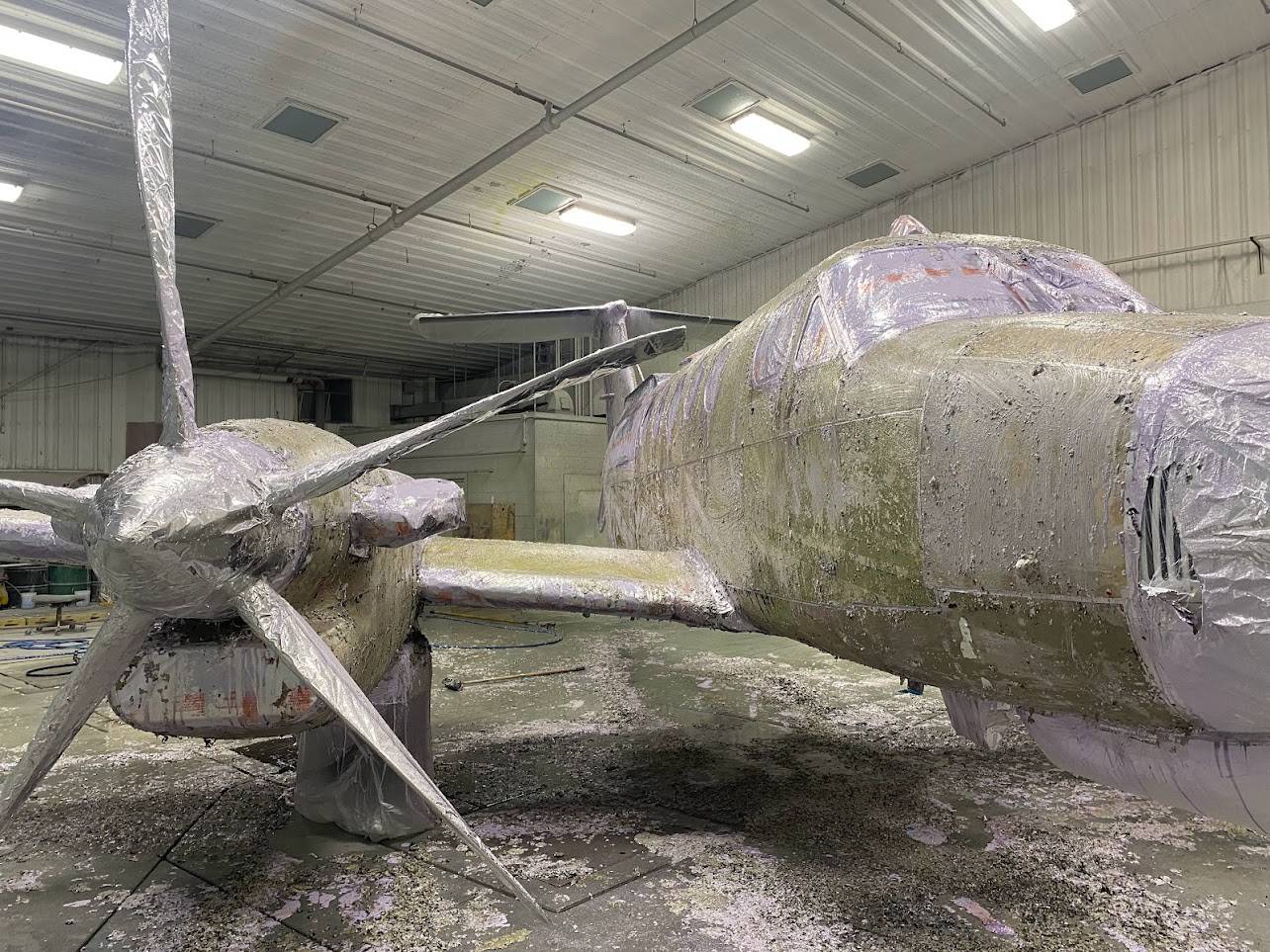 The aircraft in the process of paint removal