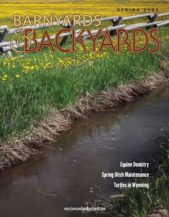 Image of front cover of magazine.  Image of field with irrigation ditch.