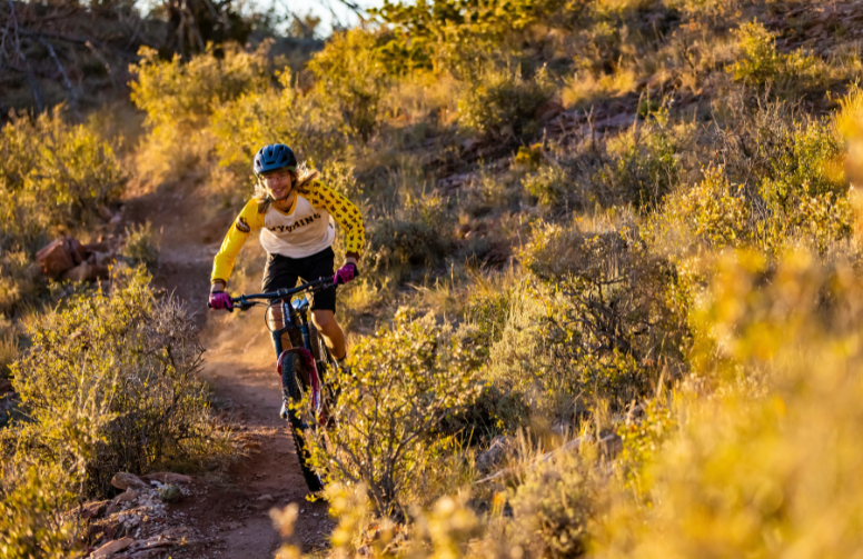 A person mountain biking through Pilot Hill