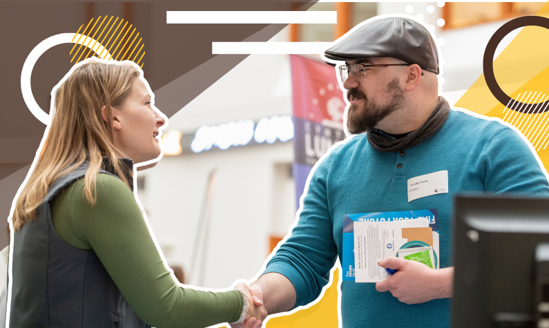 people shaking hands at a career fair