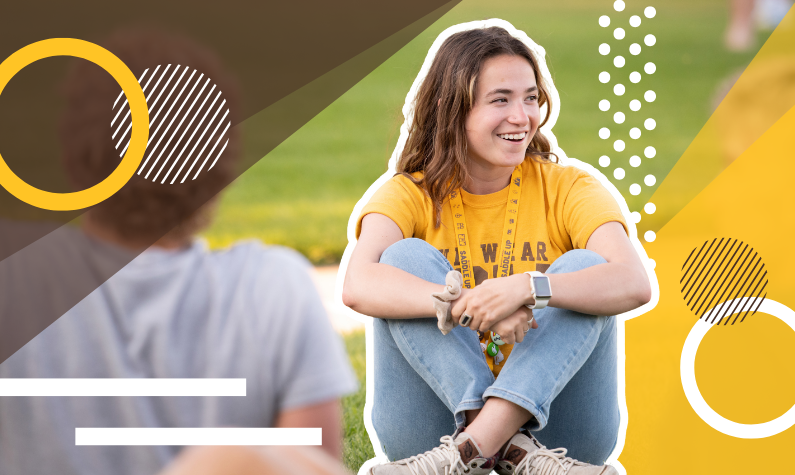 A UW student chatting with others in Prexy's Pasture