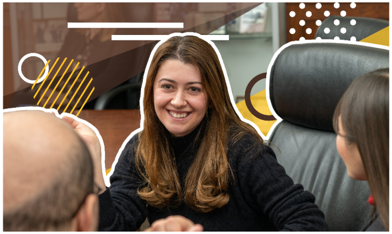 people chatting at a conference table