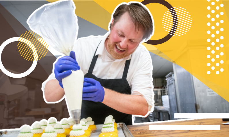 a person decorating dessert items in a UW kitchen 