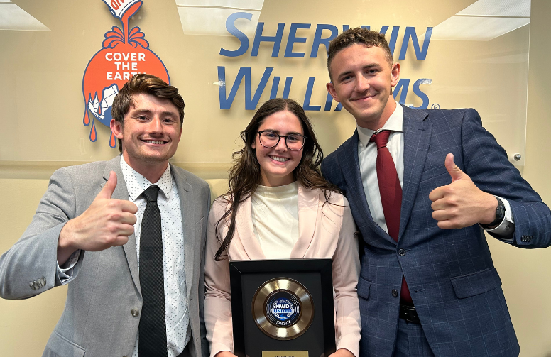 Cameron and two peers during an internship.