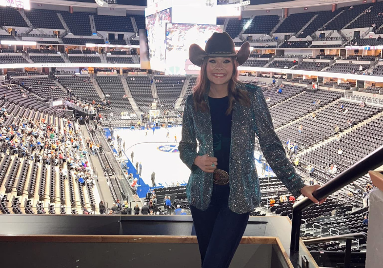 Makena in a glittery blazer at a denver nuggets event